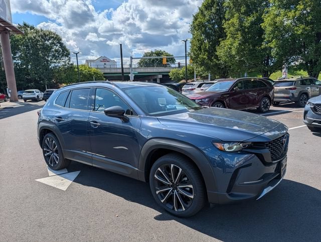 2026 Mazda Mazda CX-50 2.5 Turbo Premium Plus AWD in Ingot Blue Metallic — front three-quarter view